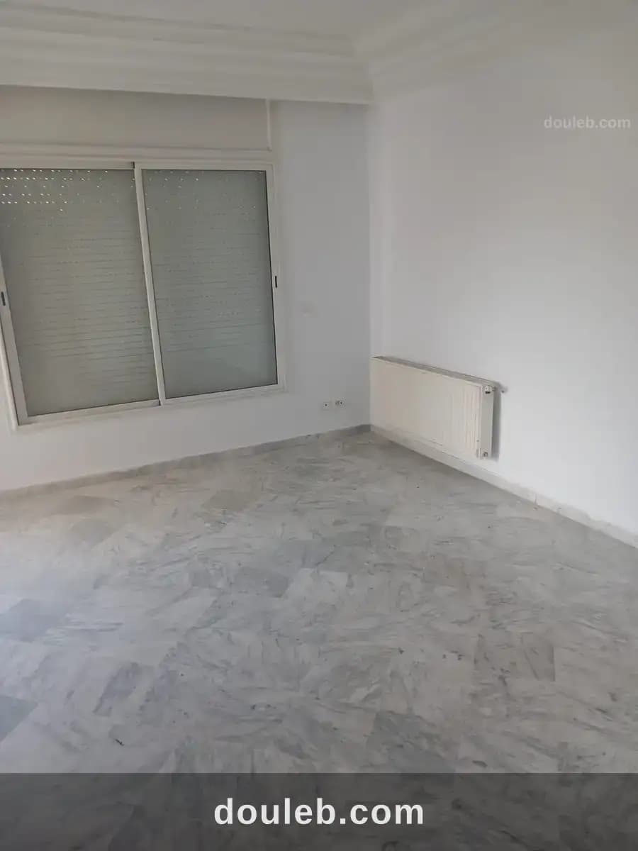 Un appartement s 2 cité nasr 2 - Miniature 2