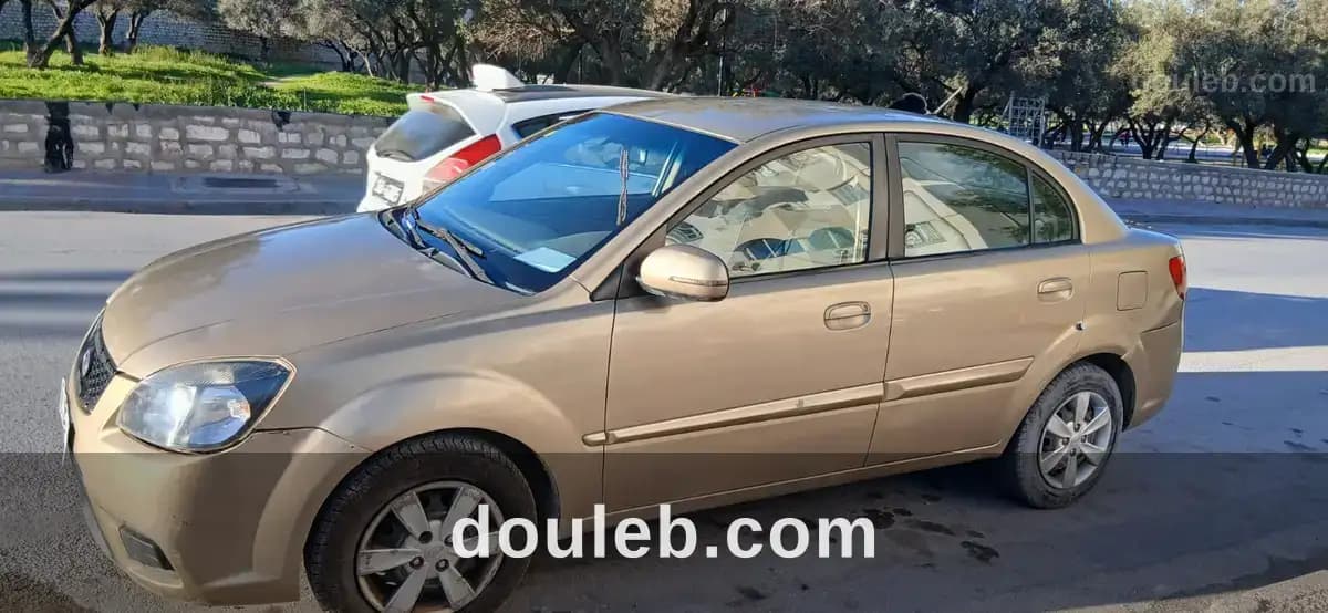Kia rio 1ere main - Photo 1