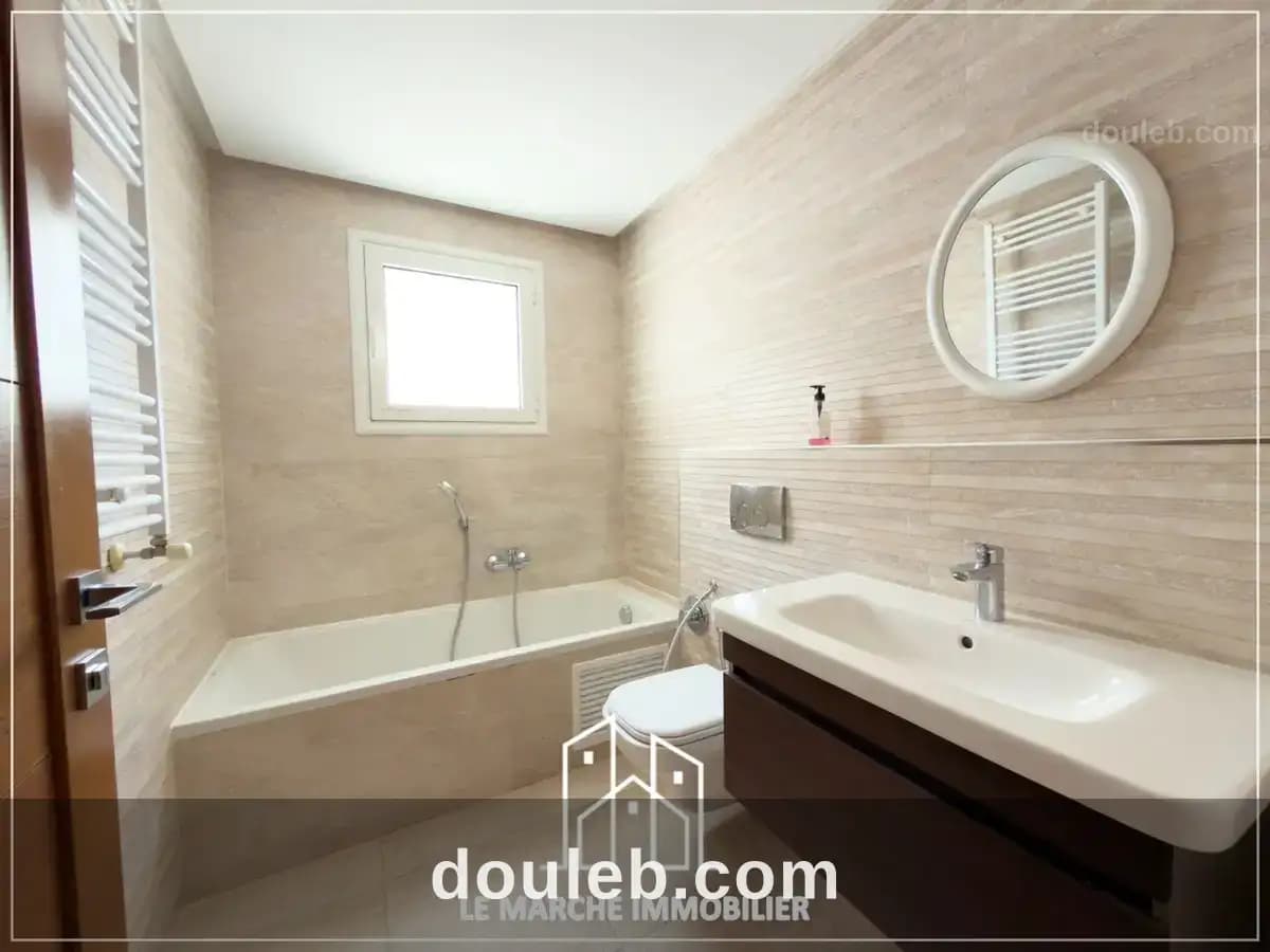 Un appartement trois chambres a ennaser - Miniature 5