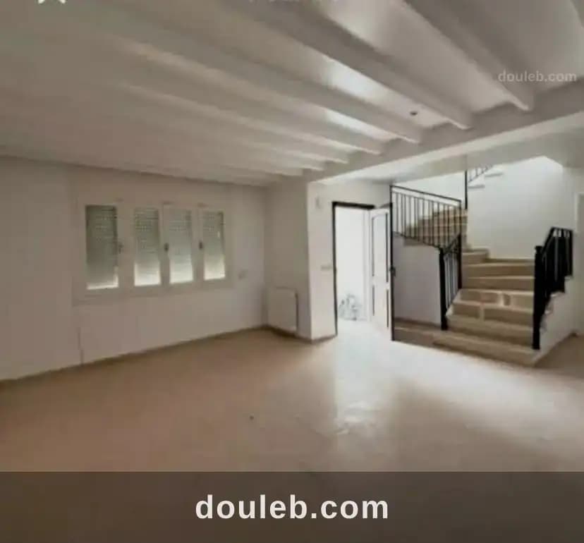 Un duplex propre avec jardin qui done sur deux rue - Photo 1