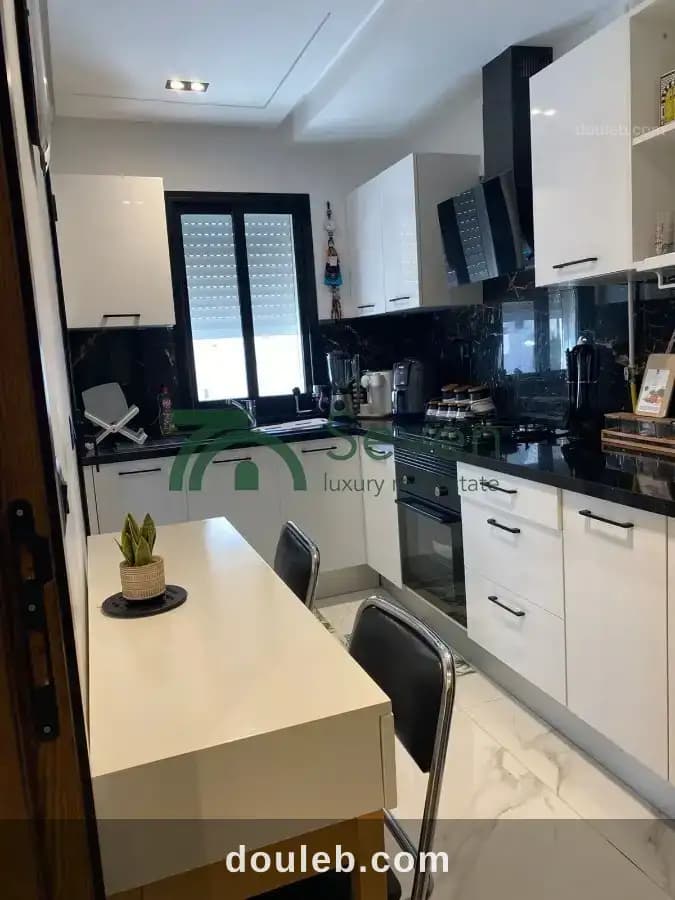 Un appartement en s2 à cité les palmerais - Miniature 3