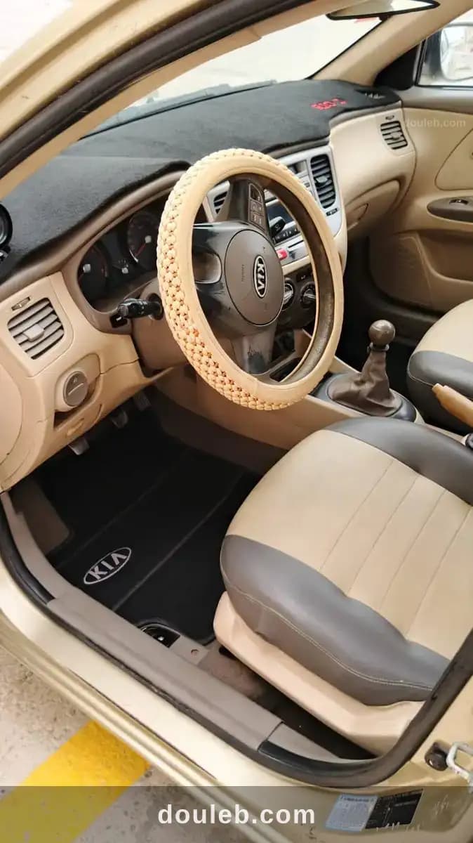 Kia rio anne 2010 essence premiere main - Miniature 4
