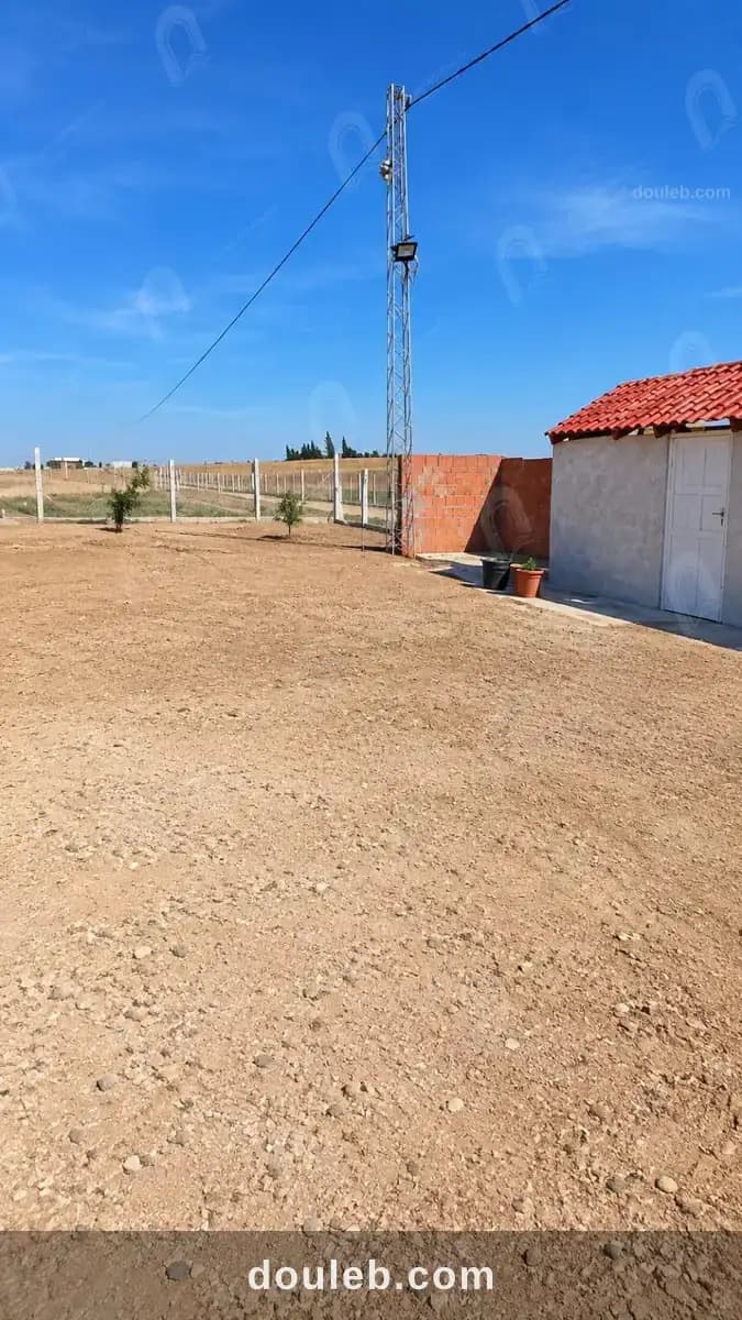 Un terrain de 1440m2 a borj el amri - Miniature 2