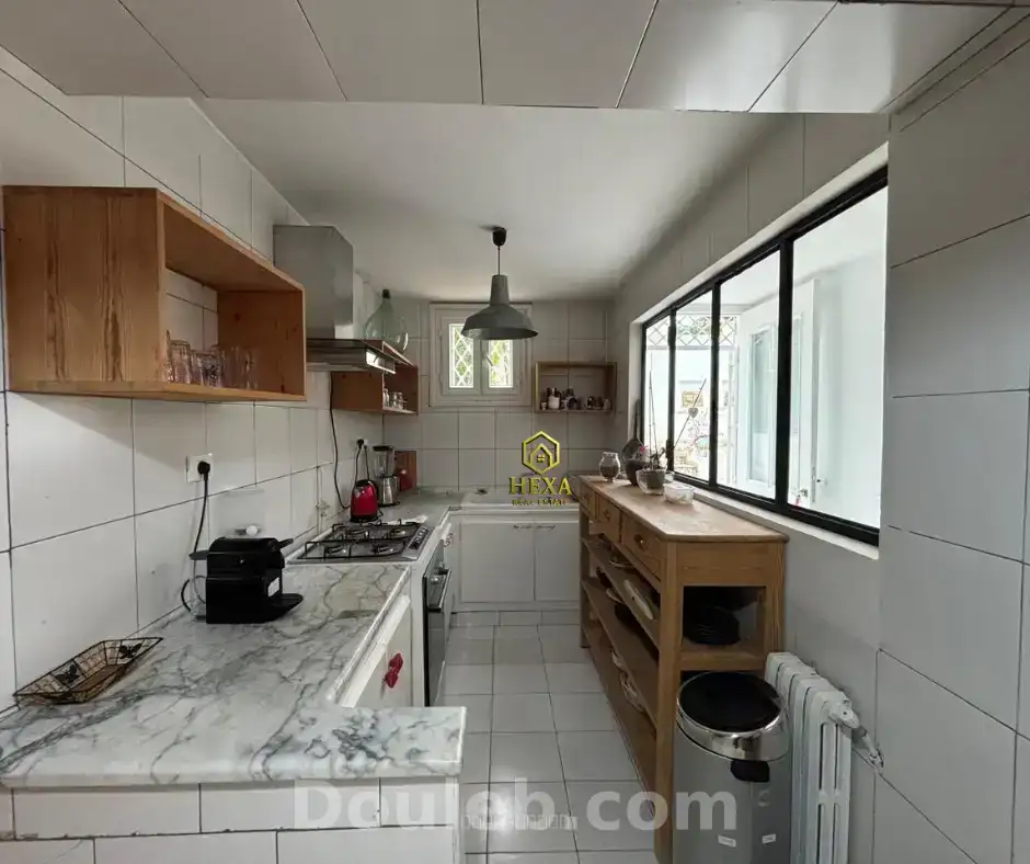 Réez de chaussée avec jardin s3 à la marsa ville - Miniature 2