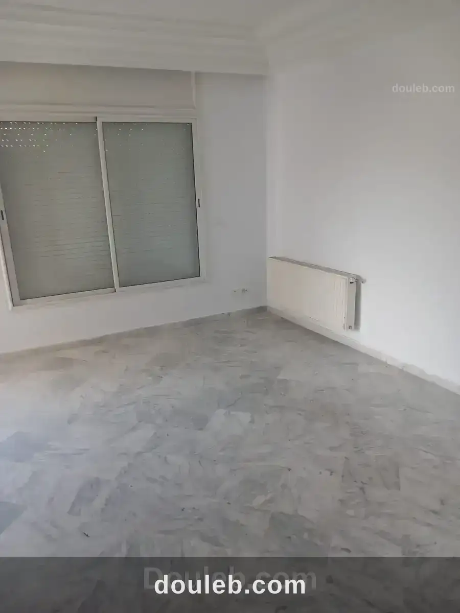 Un appartement s 2 cité nasr 2 - Miniature 2